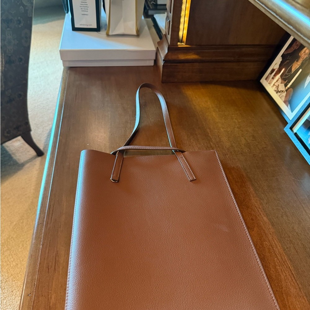 CH Carolina Herrera brown leather computer sleeve